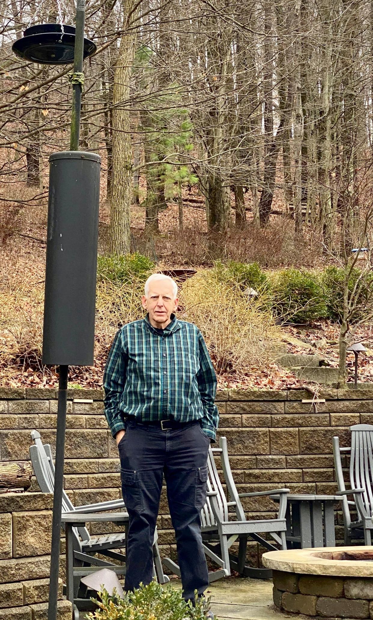 Mel Preston stands in his backyard where he and his wife of 56 years, Diane, loved to watch birds. Mel and his family have founded the nonprofit Diane’s Seeds for Hope in memory of Diane, who died from pancreatic cancer in 2020. The nonprofit serves as a tribute for both Diane's commitment in life to making a difference and Mel's dedication to fighting pancreatic cancer.