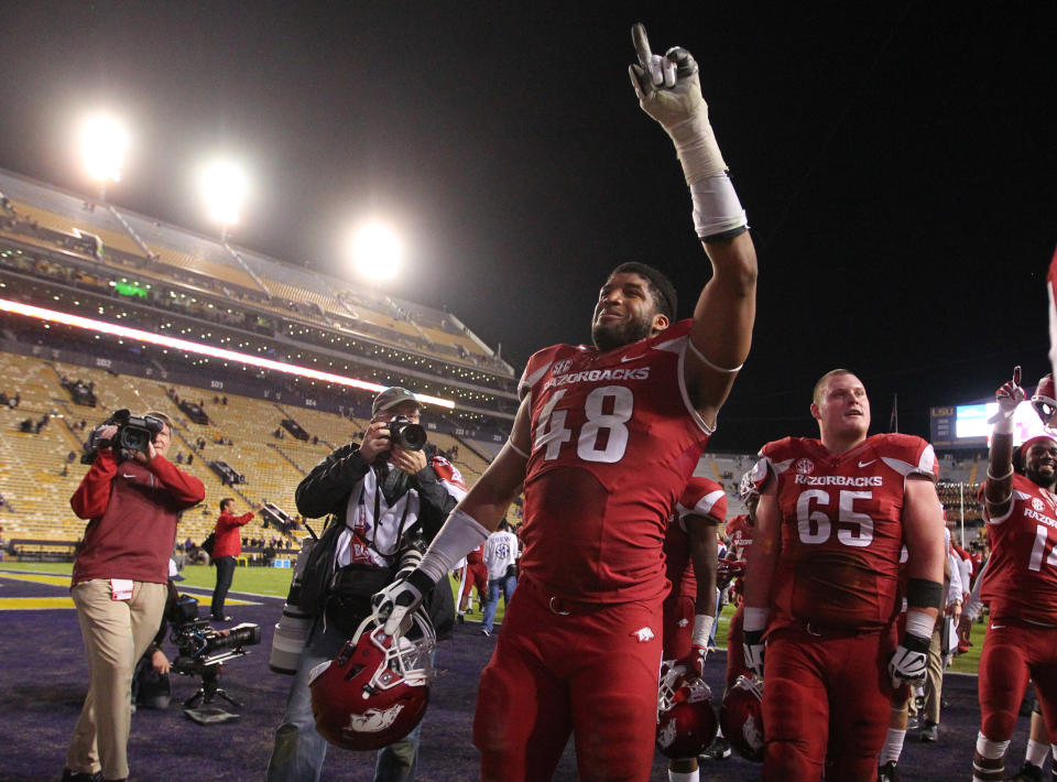 Nov 14, 2015; Baton Rouge, LA, USA; Arkansas Razorbacks defensive lineman <a class="link " href="https://sports.yahoo.com/nfl/players/30244" data-i13n="sec:content-canvas;subsec:anchor_text;elm:context_link" data-ylk="slk:Deatrich Wise Jr.;sec:content-canvas;subsec:anchor_text;elm:context_link;itc:0">Deatrich Wise Jr.</a> (48) celebrates after defeating the LSU Tigers 31-14 at Tiger Stadium. Mandatory Credit: Crystal LoGiudice-USA TODAY Sports