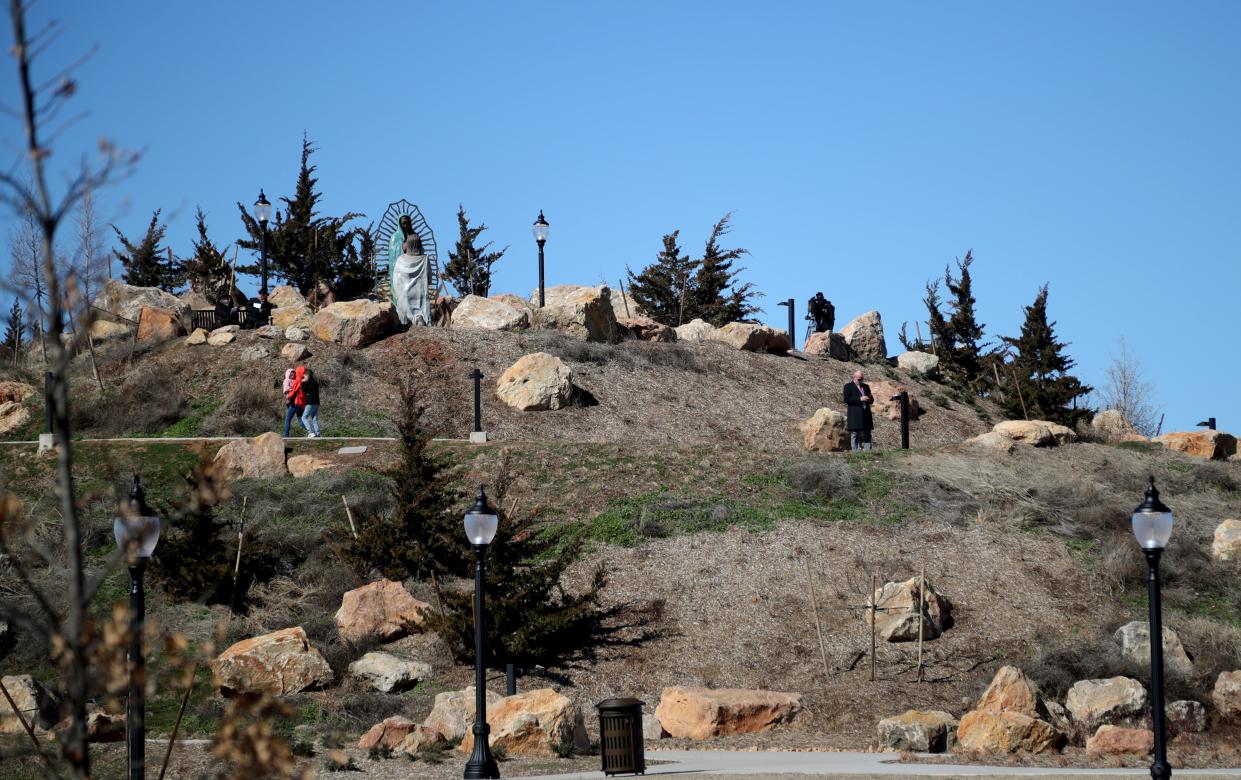 People walk on the Tepeyac Hill on Feb. 16, 2023, at The Blessed Stanley Rother Shrine in Oklahoma City.