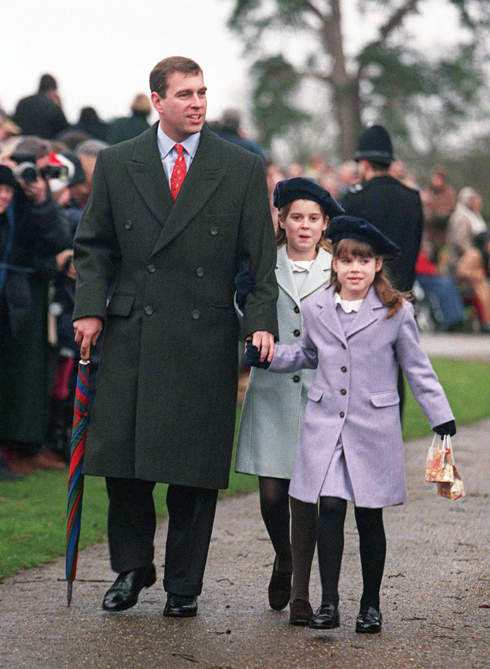 The cute girls held on to their father, Prince Andrew’s hand in 1998 during a wet Christmas Day. Photo: Getty Images