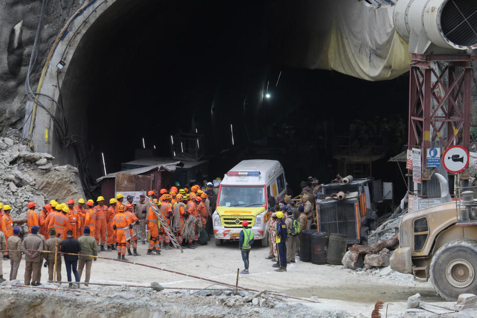 An ambulance waits to carry workers from the site of an under-construction road tunnel that collapsed in Silkyara in the northern Indian state of Uttarakhand, India, Tuesday, Nov. 28, 2023. Officials in India said Tuesday they were on the verge of rescuing the 41 construction workers trapped in a collapsed mountain tunnel for over two weeks in the country's north, after rescuers drilled their way through debris to reach them. (AP Photo)