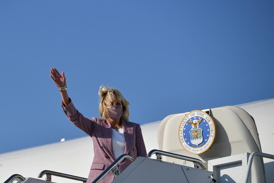 First lady Jill Biden waves as she arrives at Erie International Airport in Erie, Pa., Wednesday, March 3, 2021. (Mandel Ngan/Pool via AP)