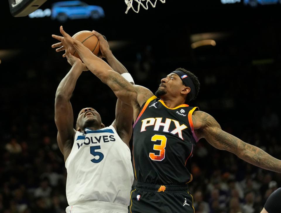 Phoenix Suns guard Bradley Beal (3) defends Minnesota Timberwolves guard Anthony Edwards (5) during game 4 of the Western Conference first round series at Footprint Center on Sunday, April 28, 2024.