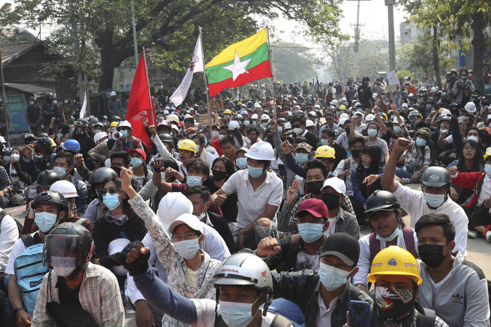 Protesters made up of teachers, medical students and other university students gather for an anti-coup demonstration in Mandalay, Myanmar Saturday, March 13, 2021. Police in Myanmar fired rubber bullets and tear gas at protesters in the country's two largest cities and elsewhere on Friday, as authorities continued their harsh crackdown on opponents of last month's military coup. (AP Photo)