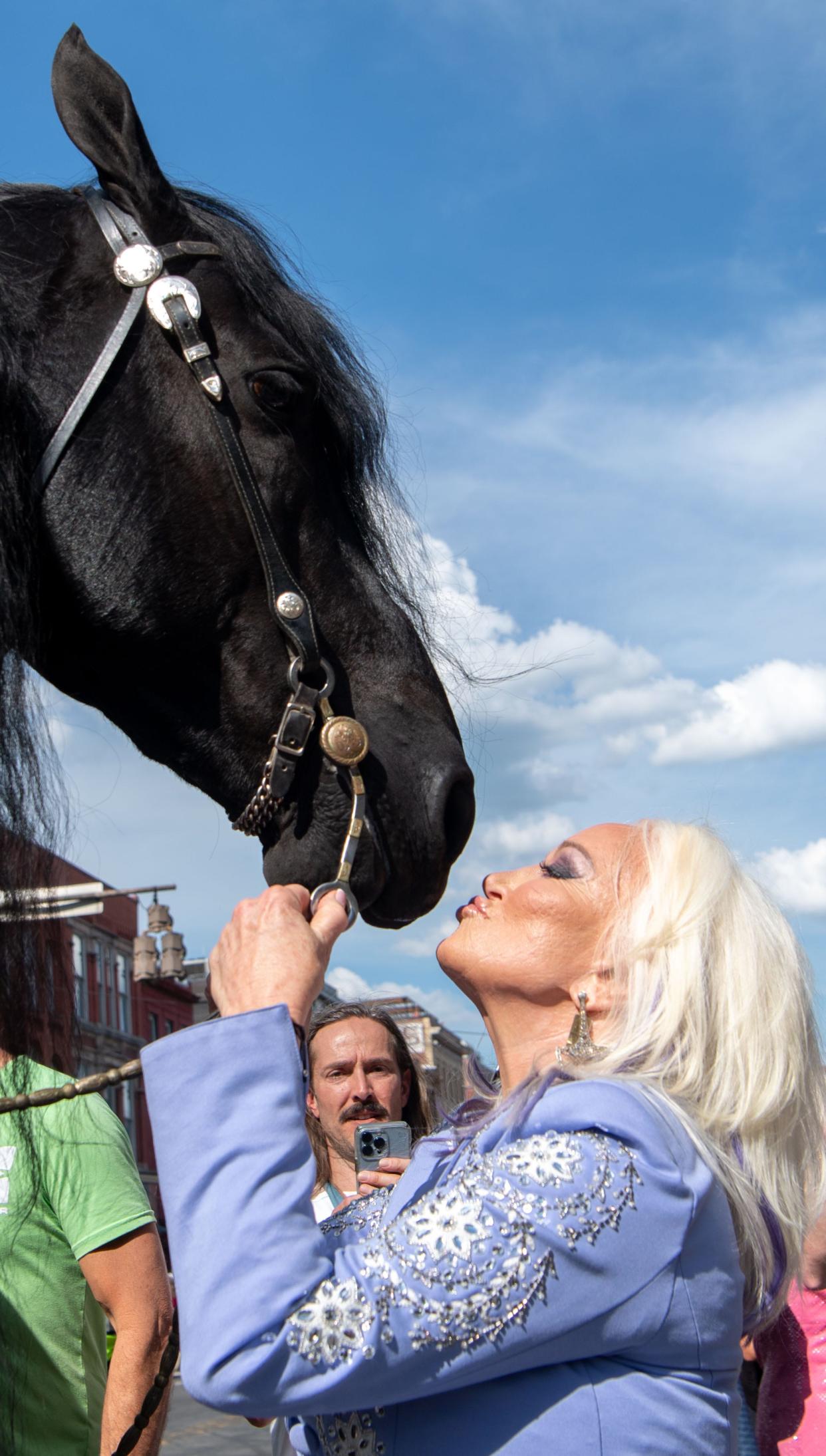 Tanya Tucker goes for kiss to Lauw the Magnificent on Broadway after riding the horse as a grand entrance for her pop-up bar Tanya Tucker’s Tequila Cantina at the Nudie’s Honky Tony in Nashville, Tenn., Thursday, May 2, 2024.
