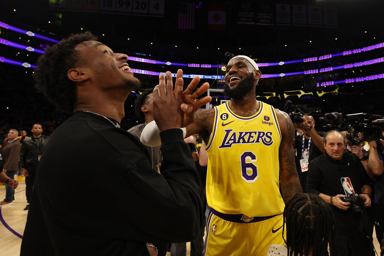  LeBron James celebrates becoming the NBA's all-time scoring leader with Bronny in February. (Harry How/Getty Images)