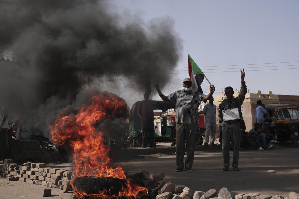 People protests against the October military coup and subsequent deal that reinstated Prime Minister Abdalla Hamdok in Khartoum, Sudan, Monday, Dec. 13, 2021. (AP Photo/Marwan Ali)