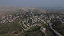 In this Tuesday, Feb. 18, 2020 photo, a view of the West Bank settlement of Ma'ale Efraim on the hills of the Jordan Valley. Israel's Prime Minister Benjamin Netanyahu is eager to court the votes of the country's influential West Bank settlers in critical elections next month. President's Donald Trump's Mideast plan seemed to be the key to ramping up their support. The plan envisions Israel's eventual annexation of its scores of West Bank settlements — a long time settler dream. But in the weeks since it was unveiled, Netanyahu has stumbled over his promises to quickly carry out the annexation, sparking verbal attacks from settler leaders. (AP Photo/Ariel Schalit)