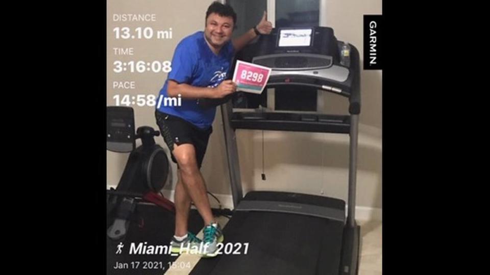 Damodar Pairaikar of Weston is shown Jan. 17, 2021 after finishing the half marathon portion of the #VirtuallyMiamiFamous on his treadmill.