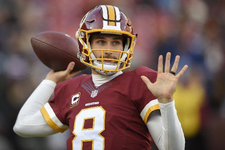 In this photo taken Jan. 1, 2017, Washington Redskins quarterback Kirk Cousins (8) warms up before an NFL football game against the New York Giants in Landover, Md. Cousins' agent says the Washington Redskins' quarterback has signed his contract for the exclusive franchise tag. (AP Photo/Nick Wass)