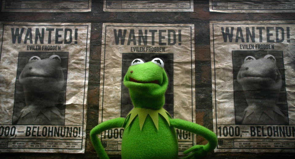 This image released by Disney shows the muppet character Constantine, a Kermit the frog look-alike, in a scene from "Muppets Most Wanted." (AP Photo/Disney Enterprises, Inc., Jay Maidment)