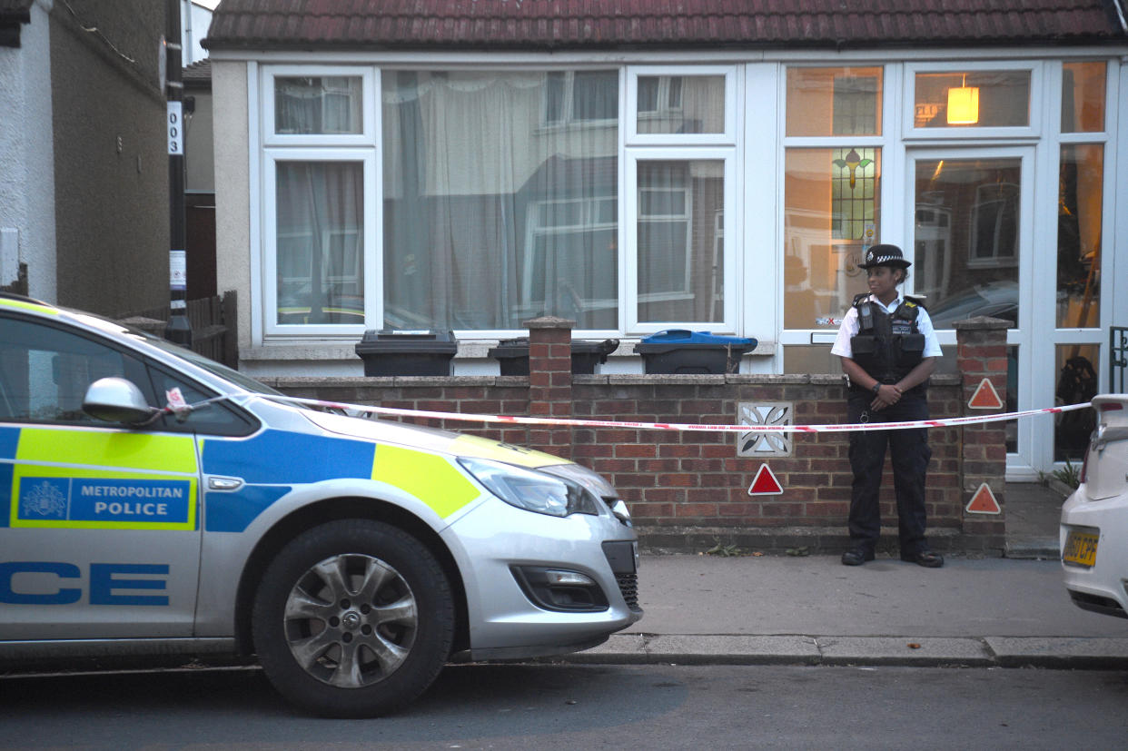 Police at the scene in Raymead Avenue, Thornton Heath, Croydon where a women who was around eight months pregnant has been stabbed to death and her baby is critically ill in hospital