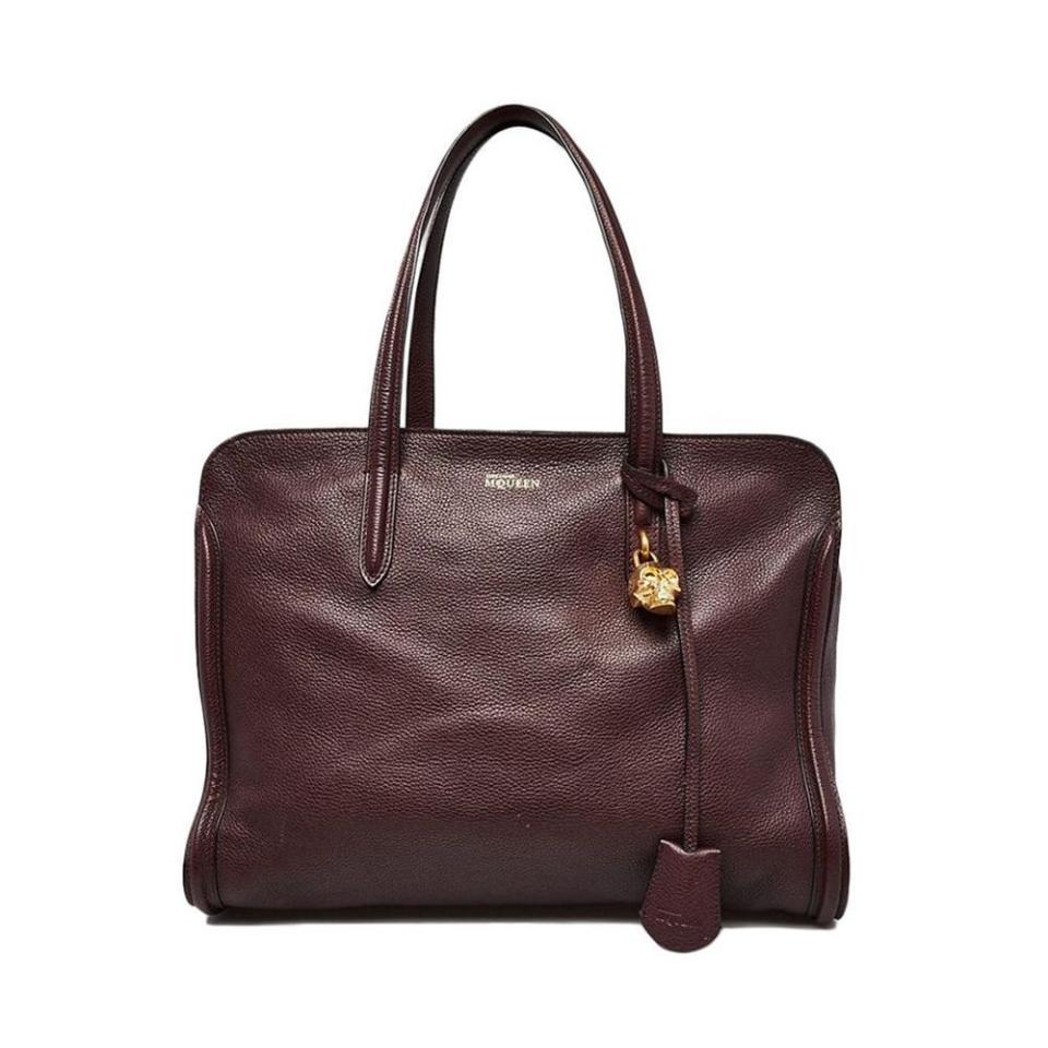 <p><a href="https://www.yoogiscloset.com/535099-alexander-mcqueen-burgundy-calfskin-leather-medium-padlock-zip-tote-bag.html" rel="nofollow noopener" target="_blank" data-ylk="slk:Shop Now;elm:context_link;itc:0;sec:content-canvas" class="link ">Shop Now</a></p><p>Burgundy Calfskin Leather Medium Padlock Zip Tote Bag</p><p>yoogiscloset.com</p><p>$795.00</p>