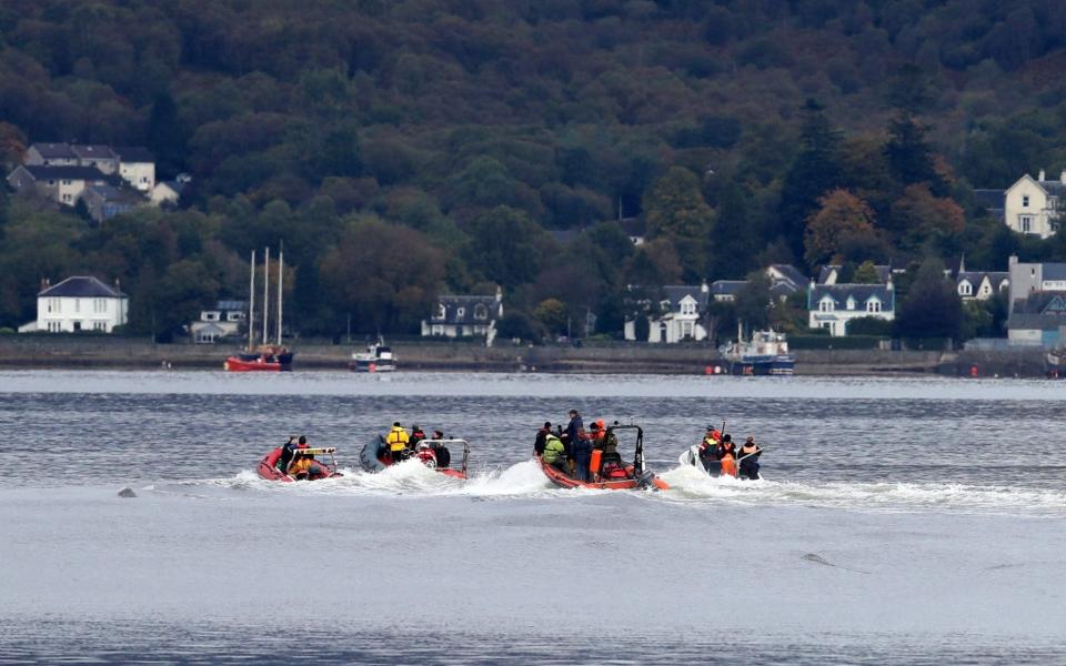 Small boats were used to try to persuade the whales to move down the loch - Andrew Milligan/PA