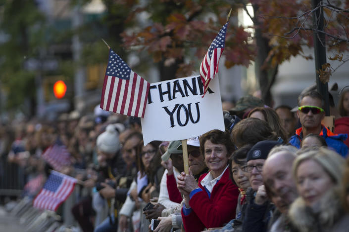 <p>A spectator holds up a sign during the Veterans Day parade on Fifth Avenue in New York on Nov. 11, 2016. <span>(Gordon Donovan/Yahoo News)</span> </p>