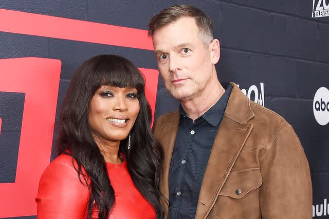 <p>Gregg DeGuire/Variety via Getty</p> Angela Bassett and Peter Krause at the "9-1-1" ABC premiere event on March 11, 2024