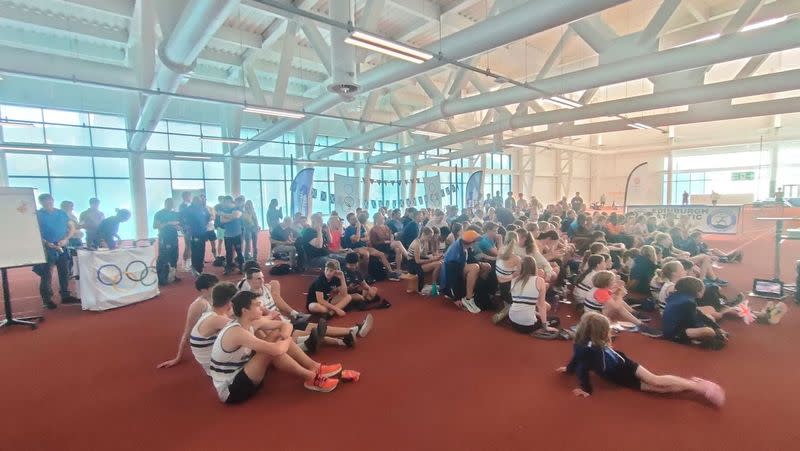 Josh Kerr's fans, friends, coaches and fellow athletes gather round to watch the track-star's race