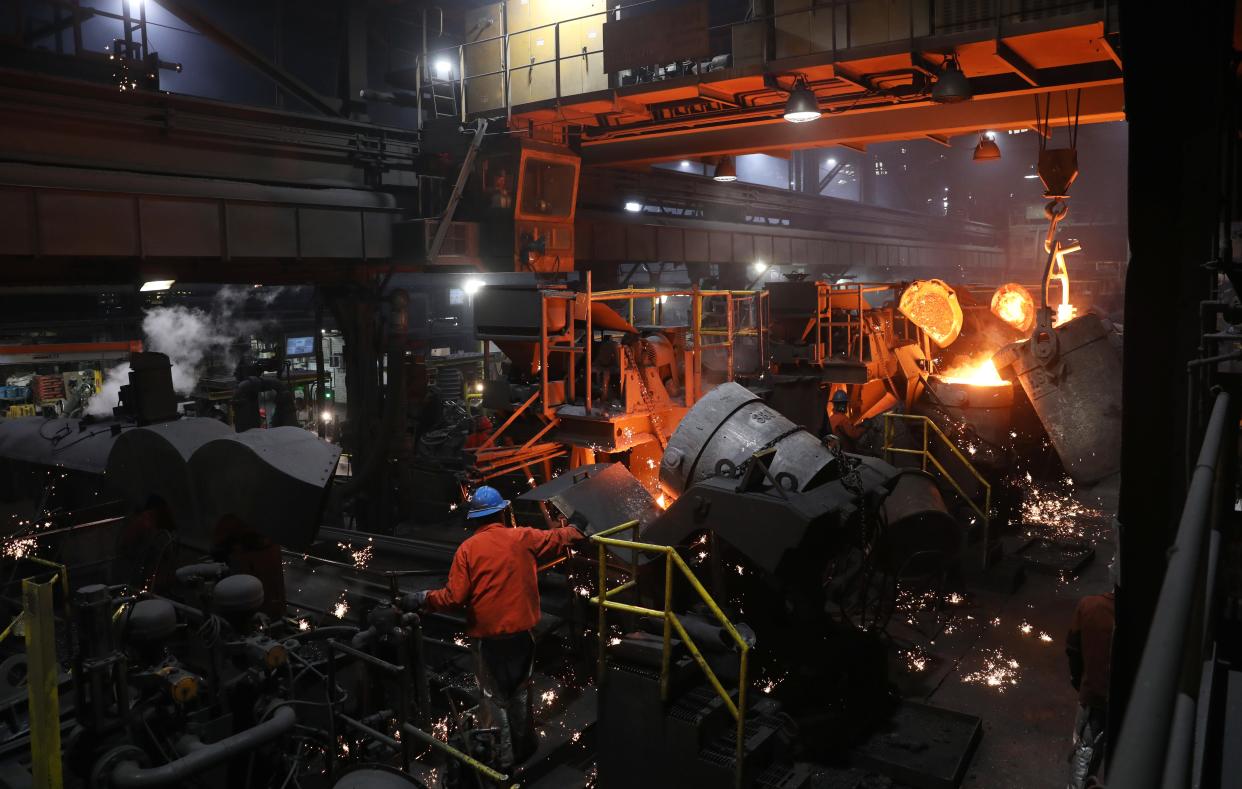 A crane pours a crucible of molten iron into a pipe making machine at McWane Ductile in Coshocton. The manufacturer is looking to expand the local plant and add 50 full-time jobs. It represent a total investment of $45 million.