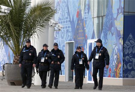 Security guards patrol at the Olympic Park in Adler near Sochi January 16, 2014. President Vladimir Putin said on Thursday no athlete would face discrimination at next month's Winter Olympics, hoping to ease international concern over a Russian law banning gay "propaganda". REUTERS/Alexander Demianchuk