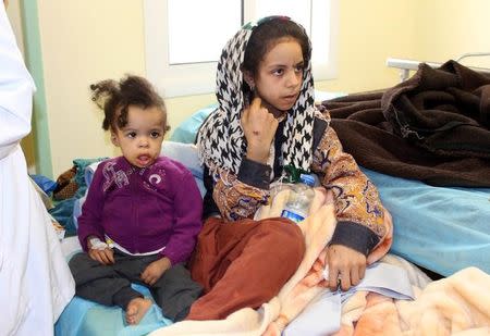 Children, who Libyan forces said left the last cluster of buildings controlled by Islamic State in the group's former stronghold of Sirte, receive medical treatment in a hospital in Misrata, Libya December 4, 2016. REUTERS/Ayman Sahely