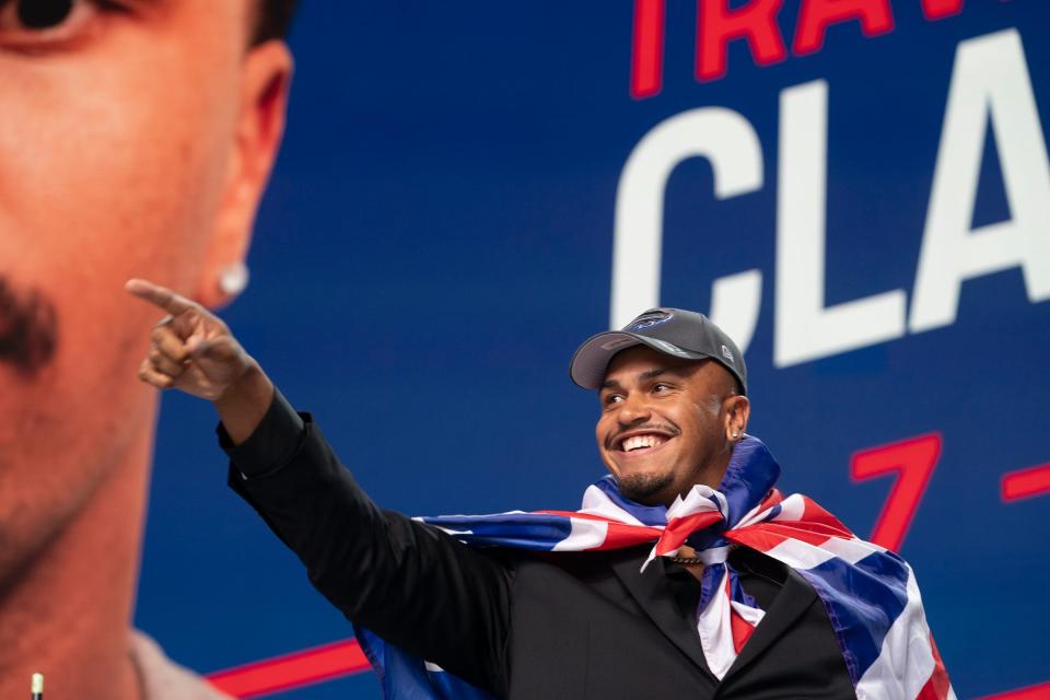 Rugby player Travis Clayton shows his excitement after being drafted by the Buffalo Bills on Saturday, April 27, 2024, during the NFL draft in Detroit.