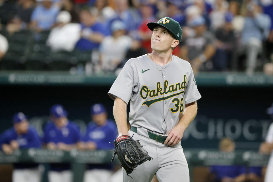 Oakland Athletics pitcher JP Sears reacts after being pulled during the seventh inning of a baseball game against the Texas Rangers Thursday, April 11, 2024, in Arlington, Texas. (AP Photo/Michael Ainsworth)