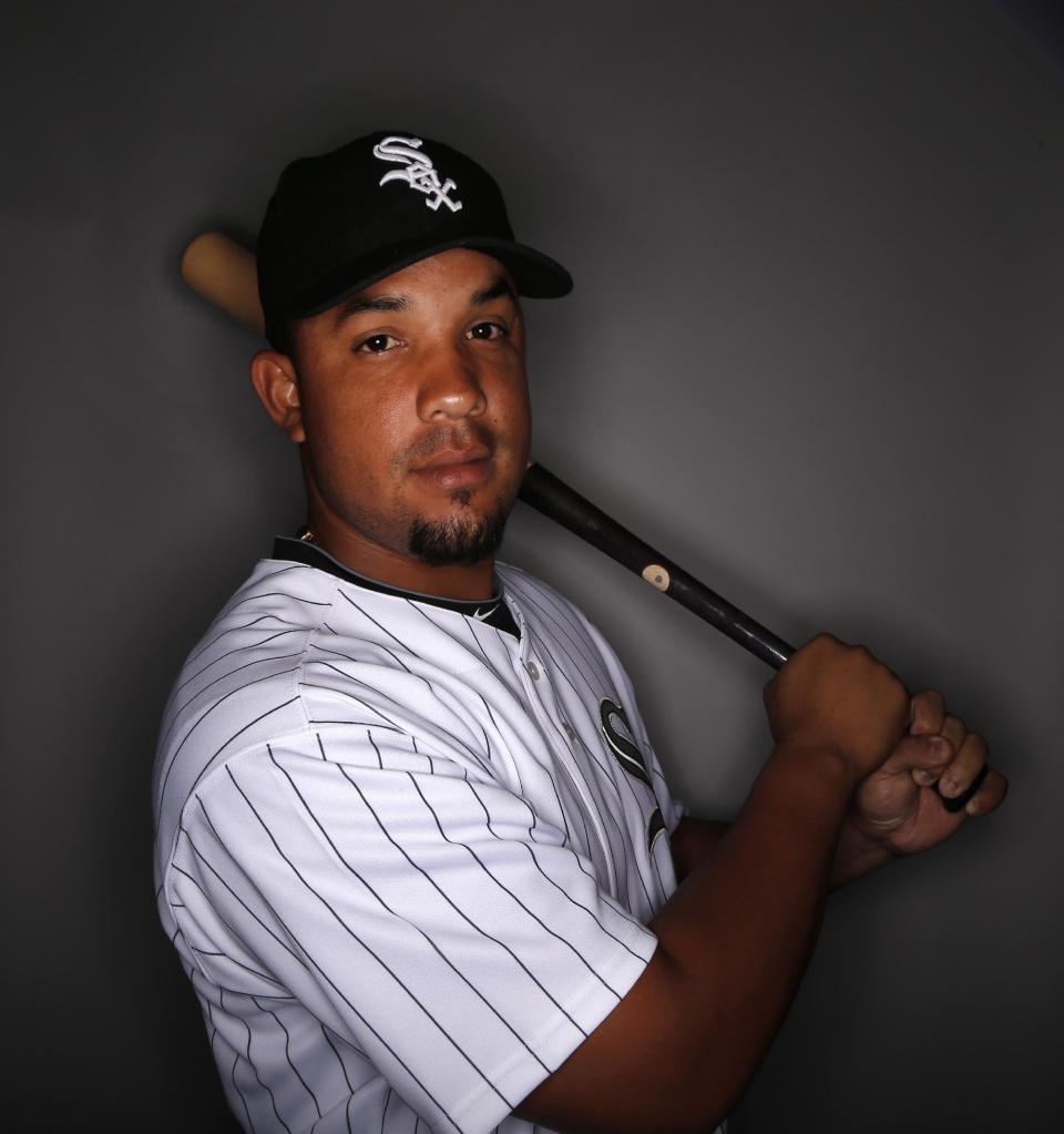 Chicago White Sox first baseman Jose Abreu poses for a photo during baseball spring training photo day Saturday, Feb. 22, 2014 in Glendale, Ariz. (AP Photo/Paul Sancya)