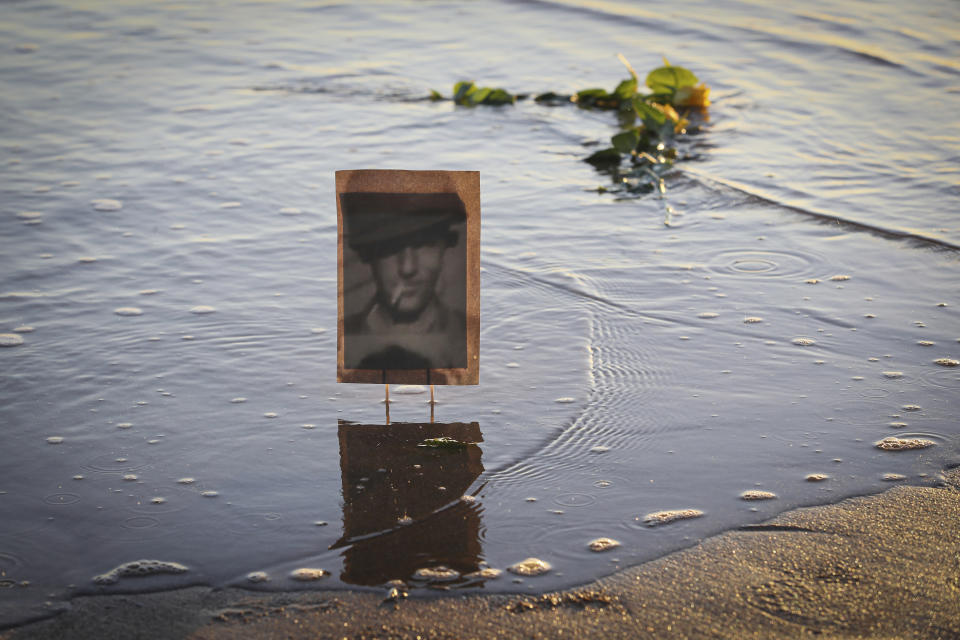 A picture of an unknown soldier is seen on the shore of Omaha Beach in Saint Laurent sur mer, Normandy, Sunday, June 6, 2021 on the eve of 77th anniversary of the assault that helped bring an end to World War II. While France is planning to open up to vaccinated visitors starting next week, that comes too late for the D-Day anniversary. So for the second year in a row, most public commemoration events have been cancelled. A few solemn ceremonies have been maintained, in the presence of dignitaries and a few guests only. (AP Photo/David Vincent)