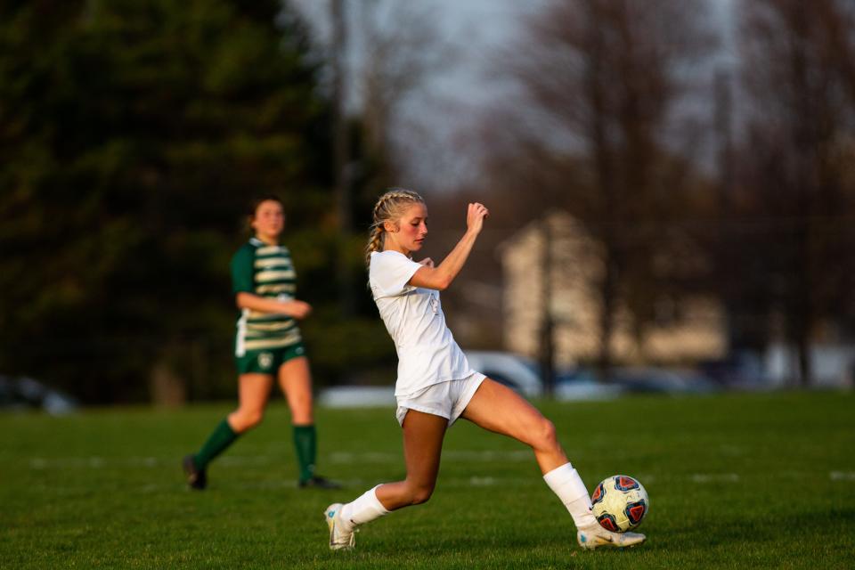 East's Summer Boone-Sautter gets a touch on the ball Tuesday, April 11, 2023, at Zeeland West. 