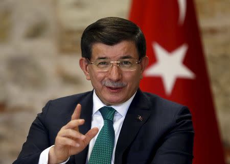 Turkish Prime Minister Ahmet Davutoglu speaks during a meeting with representatives of foreign media in Istanbul, Turkey, December 9, 2015. REUTERS/Murad Sezer