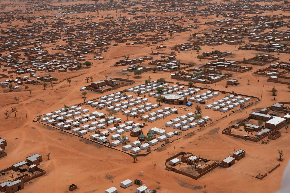 An aerial view shows a camp of internally displaced people in Djibo, Burkina Faso, Thursday May 26, 2022. African leaders have gathered for a summit in Malabo, Equatorial Guinea, to address growing humanitarian needs on the continent, which is also facing increased violent extremism, climate change challenges and a run of military coups. Leaders on Friday called for increased mobilization to resolve a humanitarian crisis that has left millions displaced and more than 280 million suffering from malnourishment. (AP Photo/Sam Mednick)