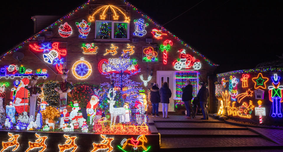 House decorated for Christmas is shown.