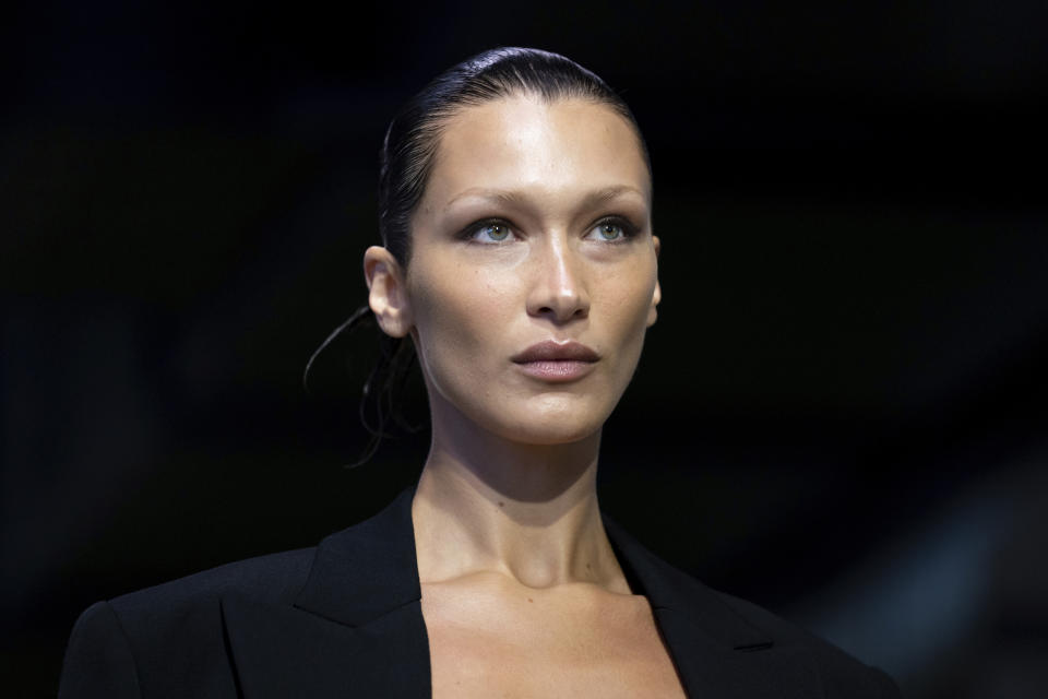 FILE - Bella Hadid models fashion from the Michael Kors collection during Fashion Week, Sept. 14, 2022, in New York. Through images that have appeared online in recent weeks, people “learned” about Hadid, a model of Palestinian descent, denouncing Hamas' attack in Israel, which didn't actually happen. Video of Hadid accepting an award for activism in Lyme Disease was manipulated to make it seem like different words were coming from her mouth. (AP Photo/Julia Nikhinson, File)