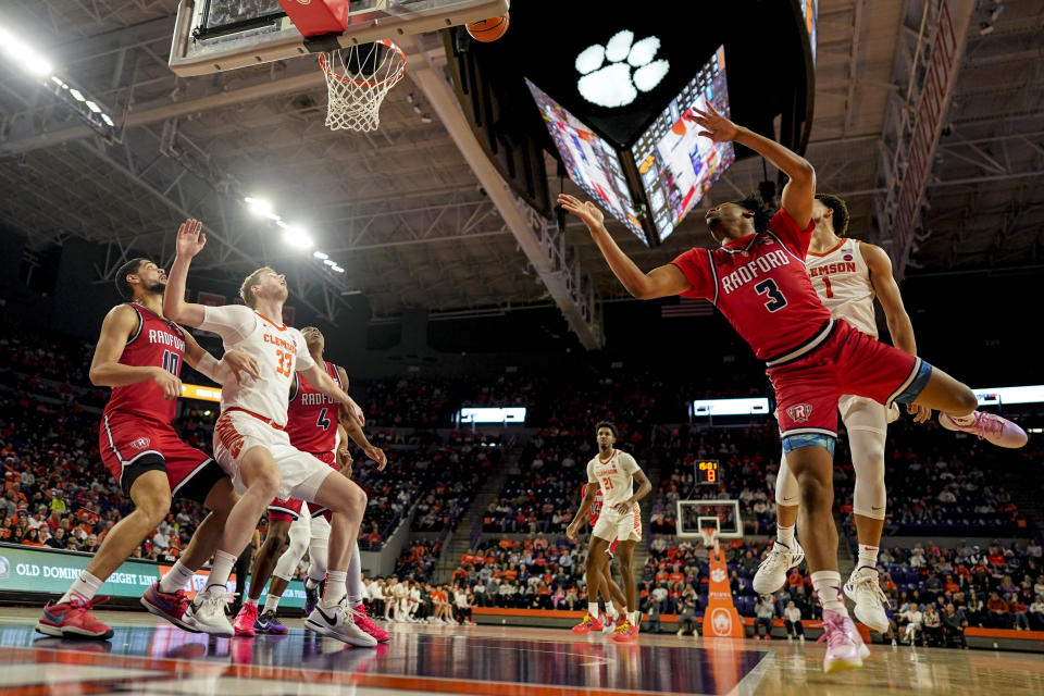 Radford guard Kenyon Giles (3) shoots against Clemson during the second half of an NCAA college basketball game, Friday, Dec. 29, 2023, in Clemson, S.C. Clemson won 93-58. (AP Photo/Mike Stewart)
