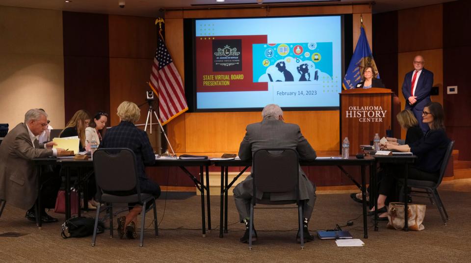 Laura Schuler, senior director for Catholic Education at Archdiocese of Oklahoma City, and Michael Scaperlanda, chancellor for the Archdiocese of Oklahoma City, present a proposal for the nation's first publicly funded Catholic charter school on Tuesday at a meeting of the Oklahoma Statewide Virtual Charter School Board at the Oklahoma History Center.