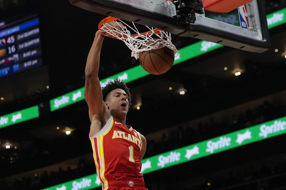 Atlanta Hawks forward Jalen Johnson (1) scores against the Phoenix Suns in the first half of an NBA basketball game Friday, Feb. 2, 2024, in Atlanta. (AP Photo/John Bazemore)