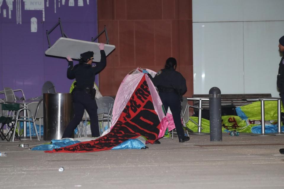 Police officers break up the encampment at NYU. William C Lopez/New York Post