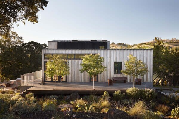 Evan Schivley of Arborica milled a custom board-and-batten shape for the home, which is cladded in reclaimed Monterrey cyprus.