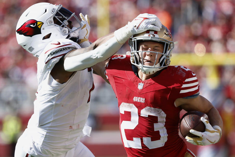 San Francisco 49ers running back Christian McCaffrey (23) runs against Arizona Cardinals linebacker Kyzir White during the second half of an NFL football game in Santa Clara, Calif., Sunday, Oct. 1, 2023. (AP Photo/Josie Lepe)