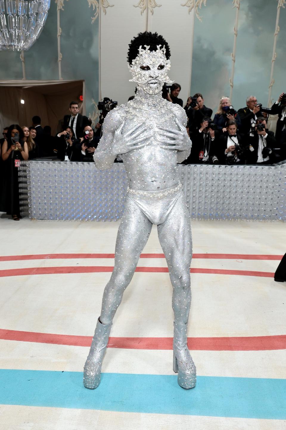 Lil Nas X showed up the 2023 Met Gala in nothing but silver underwear and metallic paint (Getty Images)