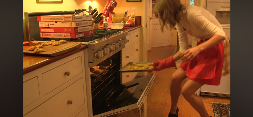Taylor Swift baking cookies for fans attending a listening session.