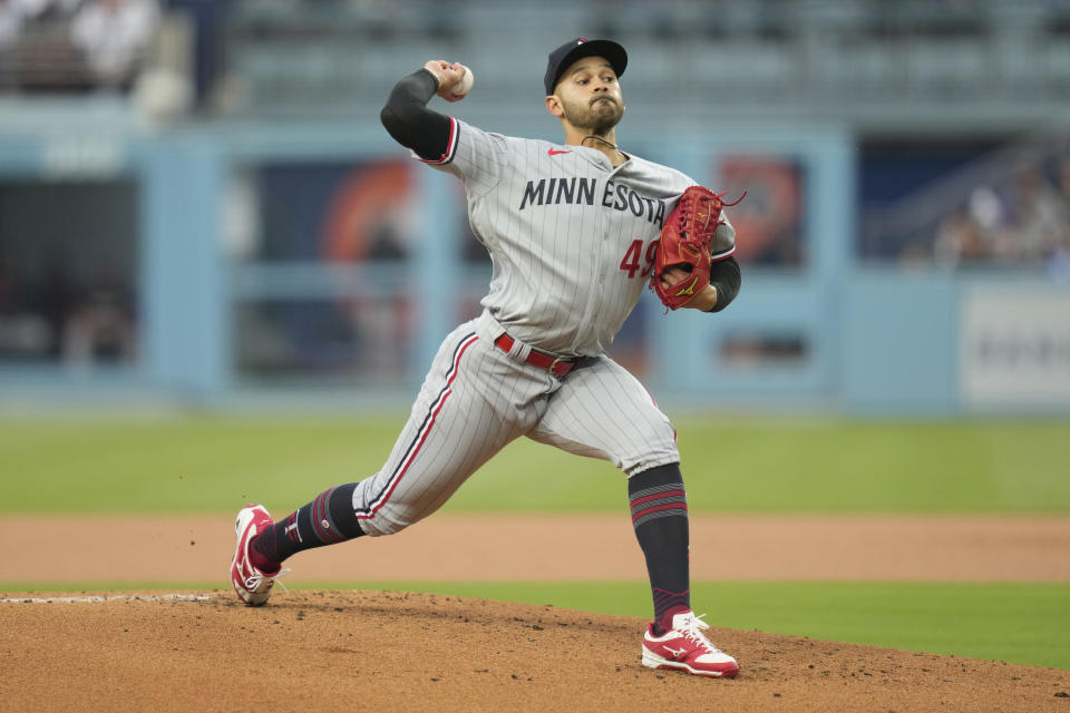 Minnesota Twins starting pitcher Pablo Lopez (49) throws during the first inning of a baseball game against the Los Angeles Dodgers in Los Angeles, Monday, May 15, 2023. (AP Photo/Ashley Landis)