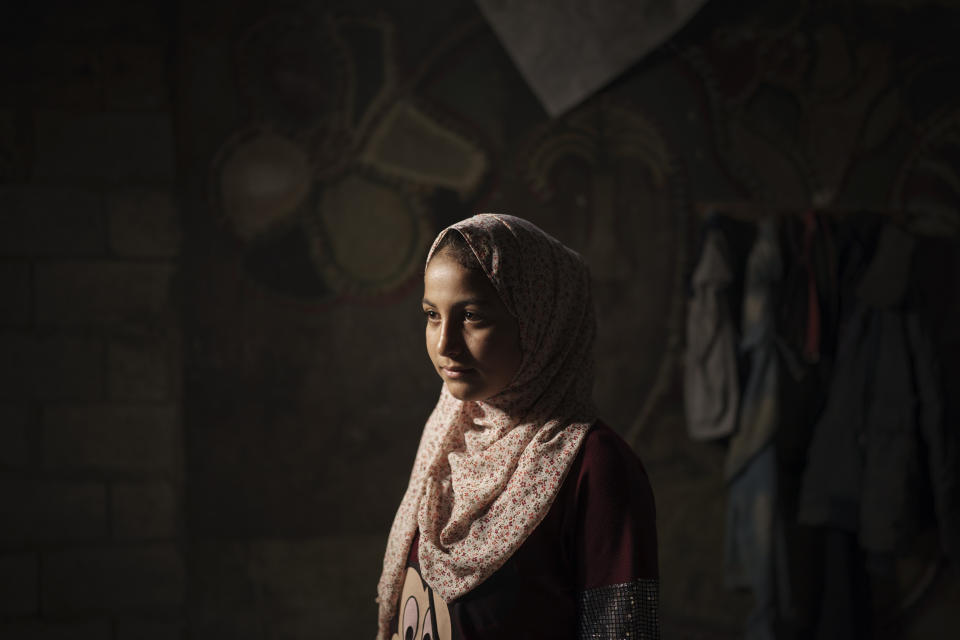 Lama Sihueil, 14, poses for a portrait in her house in Beit Hanoun, northern Gaza Strip, Sunday, June 20, 2021. (AP Photo/Felipe Dana)