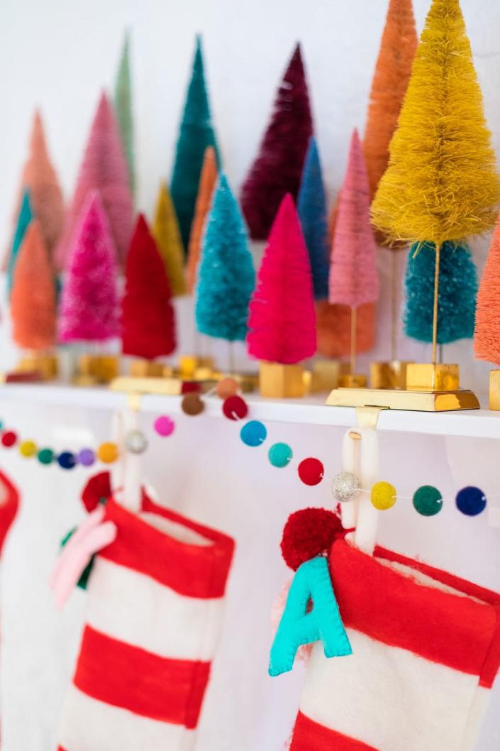 <p>Thoughtfully arrange bottle brushes of various heights, sizes and colors on your fireplace mantel, shelf or bookcase to create your very own colorful forest. </p><p><em><a href="https://studiodiy.com/where-to-buy-bottle-brush-trees-decorative-christmas-trees/" rel="nofollow noopener" target="_blank" data-ylk="slk:See more at Studio DIY »" class="link ">See more at Studio DIY »</a></em></p>