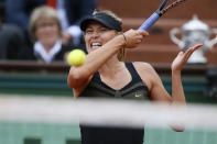 Russia's Maria Sharapova hits a return to Italy's Sara Errani during their Women's Singles final tennis match of the French Open tennis tournament at the Roland Garros stadium, on June 9, 2012 in Paris. AFP PHOTO / KENZO TRIBOUILLARDKENZO TRIBOUILLARD/AFP/GettyImages
