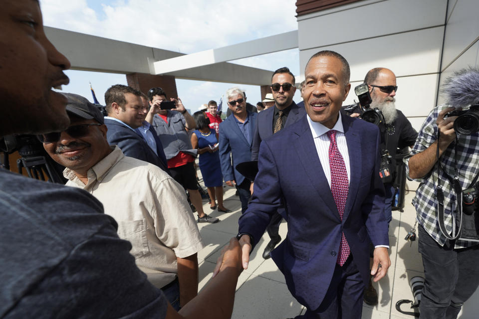 James Craig, a former Detroit Police Chief, shakes hands with supporters after announcing he is a Republican candidate for governor of Michigan in Detroit, Tuesday, Sept. 14, 2021. (AP Photo/Paul Sancya)