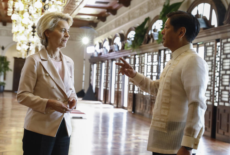 Philippine President Ferdinand Marcos Jr., right, talks to European Commission President Ursula von der Leyen, left, during the arrival ceremony at the Malacanang presidential palace in Manila, Philippines, Monday, July 31, 2023. The two leaders are expected to hold bilateral meetings to bolster European Union-Philippines relations and discuss matters on trade, security and global challenges in infrastructure. (Rolex dela Pena/Pool Photo via AP)