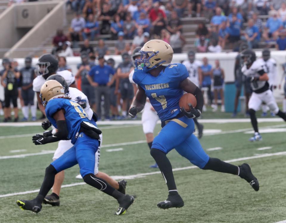 Mainland High's E'Zaiah Shine #4 turns the corner on his way to a touchdown as Matanzas High players give chase, Friday Auigust 18, 2023 in Daytona Beach.