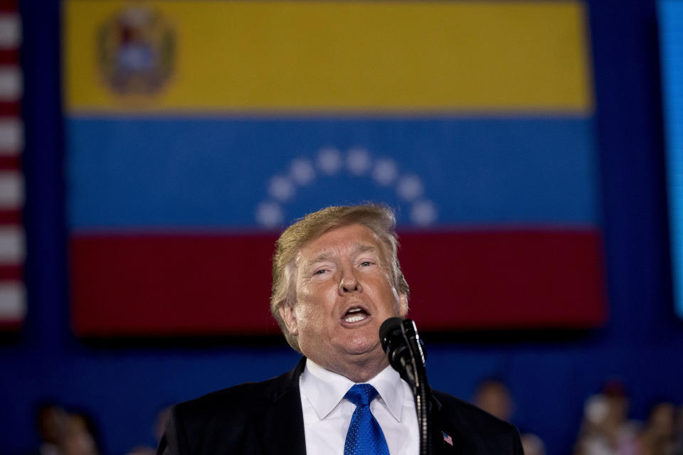 In this Monday, Feb. 18, 2019 photo, President Donald Trump speaks to a Venezuelan American community at Florida Ocean Bank Convocation Center at Florida International University in Miami, Fla., to speak out against President Nicolas Maduro's government and its socialist policies. The Trump administration is accusing Maduro of starving Venezuelans by blocking several tons of American-supplied humanitarian aid stored next door in Colombia. (AP Photo/Andrew Harnik)