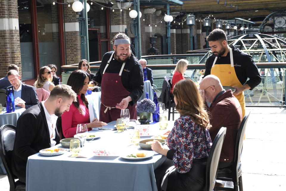 Chefs Ali Al Ghzawi and Amar Santana serve their dishes to the judges on 'Top Chef.'